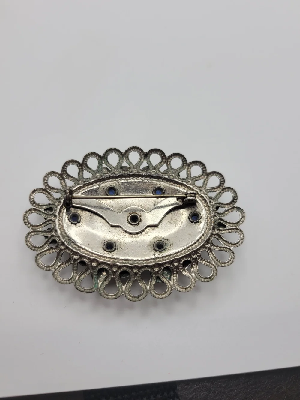 Vintage-Inspired Silver Floral Brooch with Blue Crystal Accents